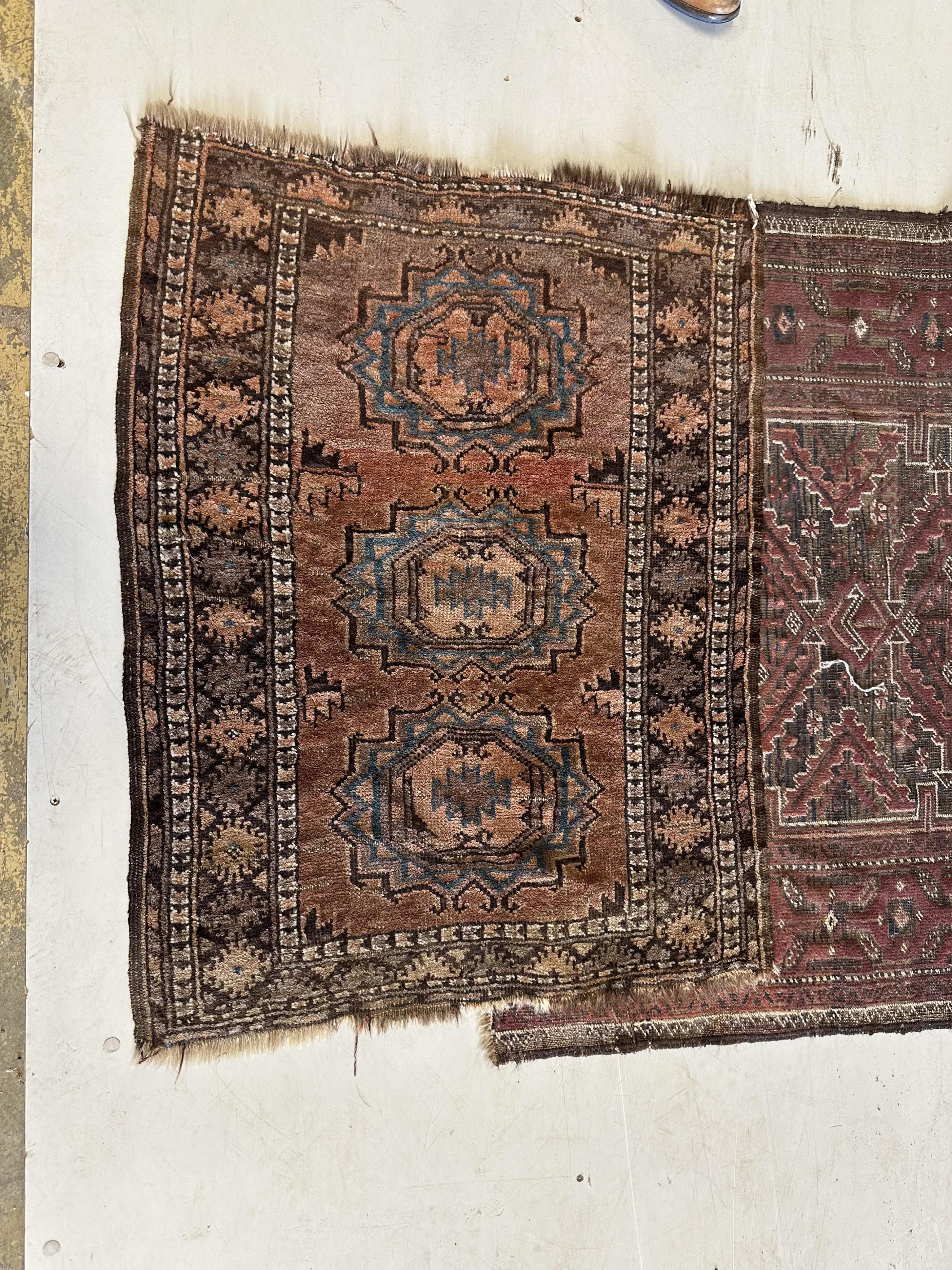 A Belouch runner and a Caucasian mat, larger 294 x 98cm. Condition - poor